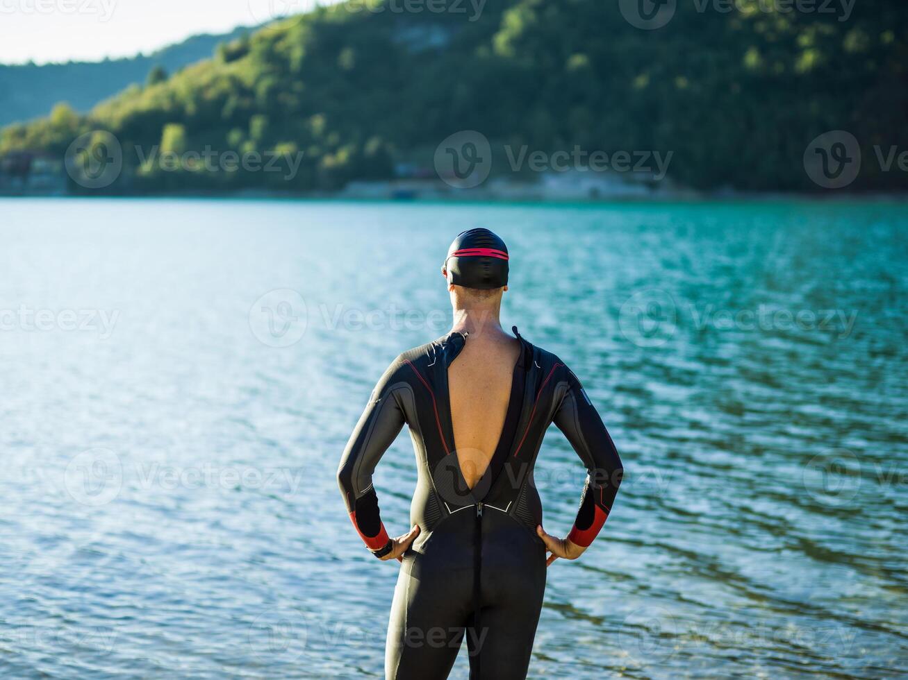 A triathlon swimmer preparing for a river training to gear up for a marathon photo