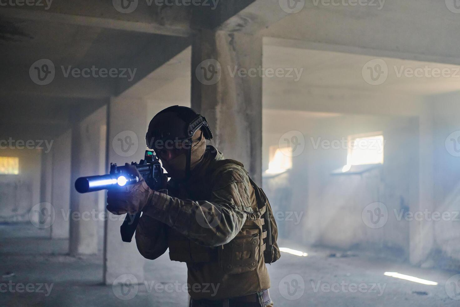 A professional soldier in an abandoned building shows courage and determination in a war campaign photo