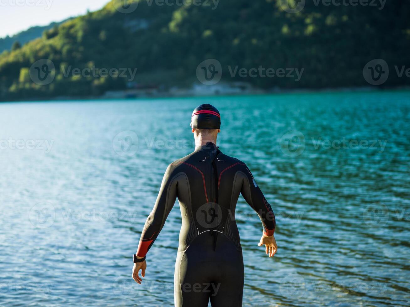 A triathlon swimmer preparing for a river training to gear up for a marathon photo