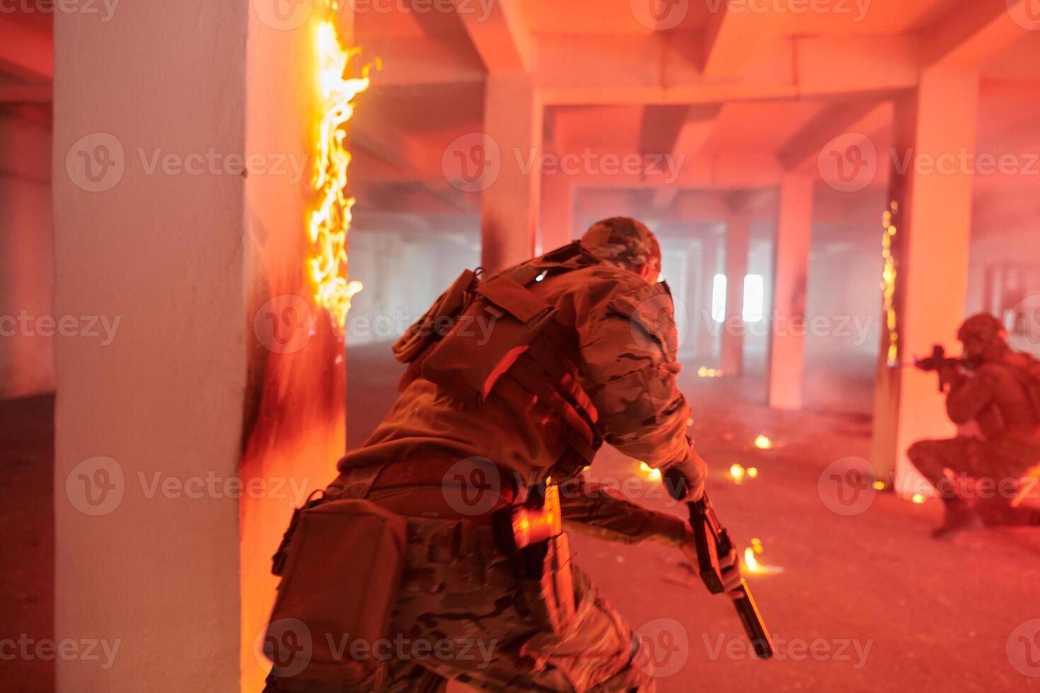 A group of professional soldiers bravely executes a dangerous rescue mission, surrounded by fire in a perilous building. photo
