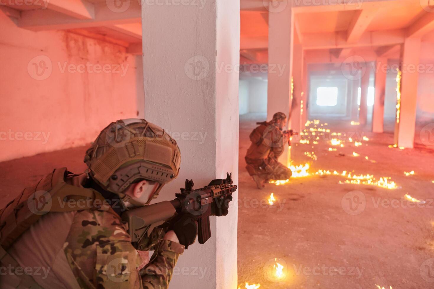 A group of professional soldiers bravely executes a dangerous rescue mission, surrounded by fire in a perilous building. photo