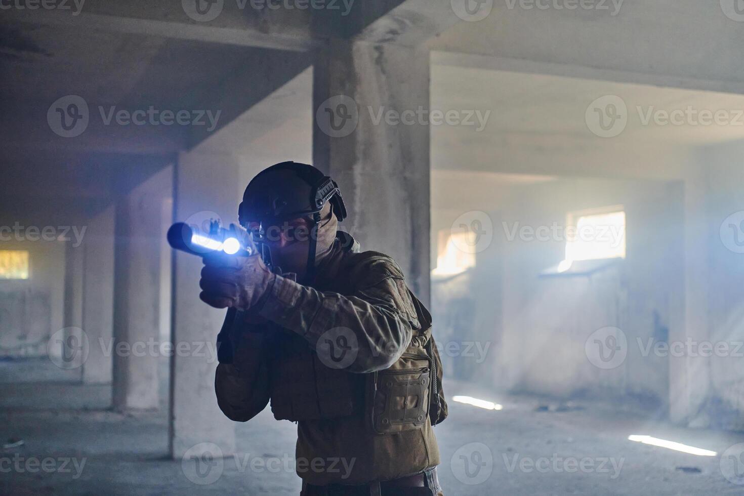 A professional soldier in an abandoned building shows courage and determination in a war campaign photo