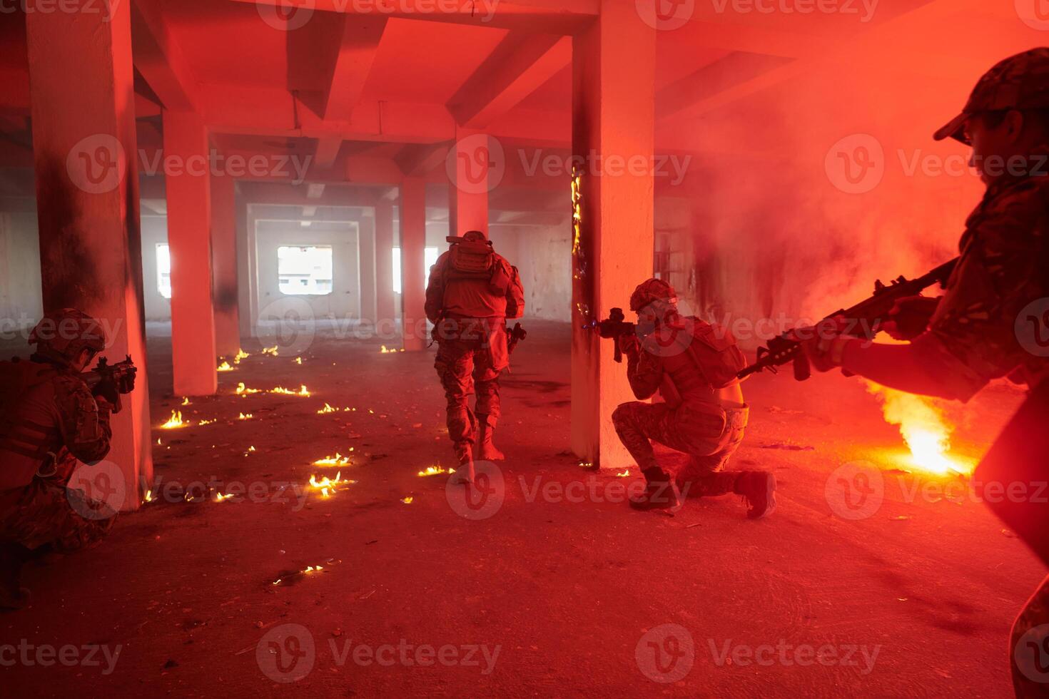 A group of professional soldiers bravely executes a dangerous rescue mission, surrounded by fire in a perilous building. photo
