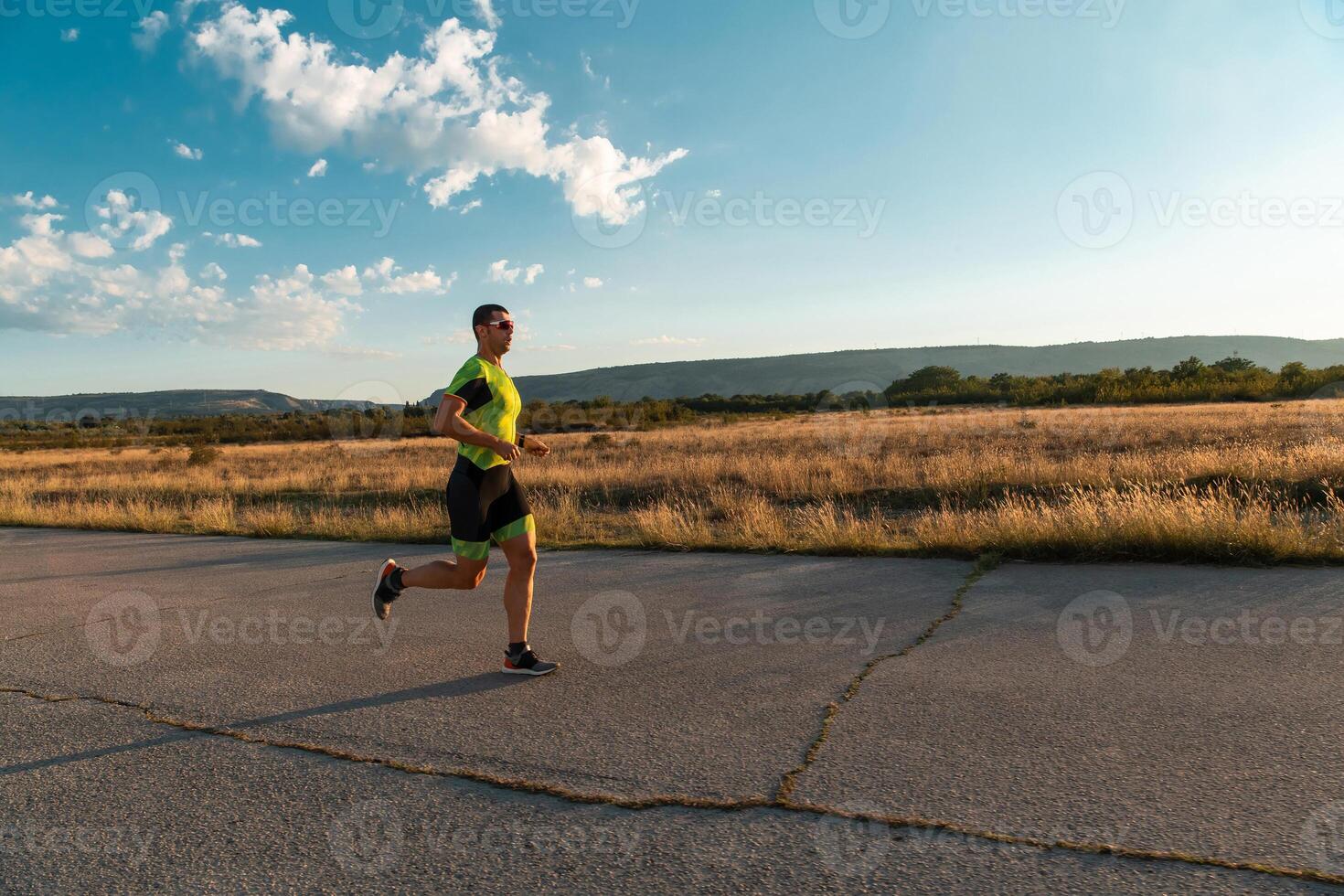 Triathlete in professional gear running early in the morning, preparing for a marathon, dedication to sport and readiness to take on the challenges of a marathon. photo