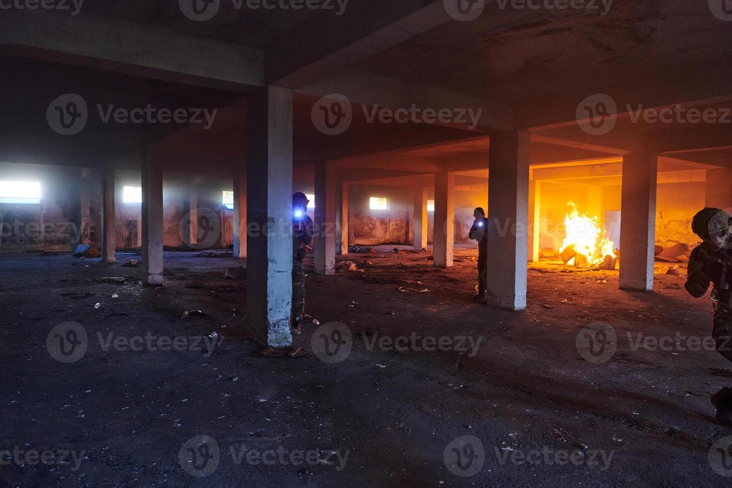 A group of professional soldiers bravely executes a dangerous rescue mission, surrounded by fire in a perilous building. photo