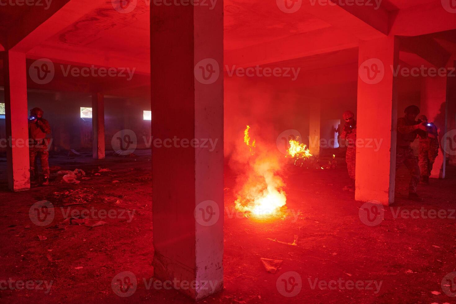 A group of professional soldiers bravely executes a dangerous rescue mission, surrounded by fire in a perilous building. photo