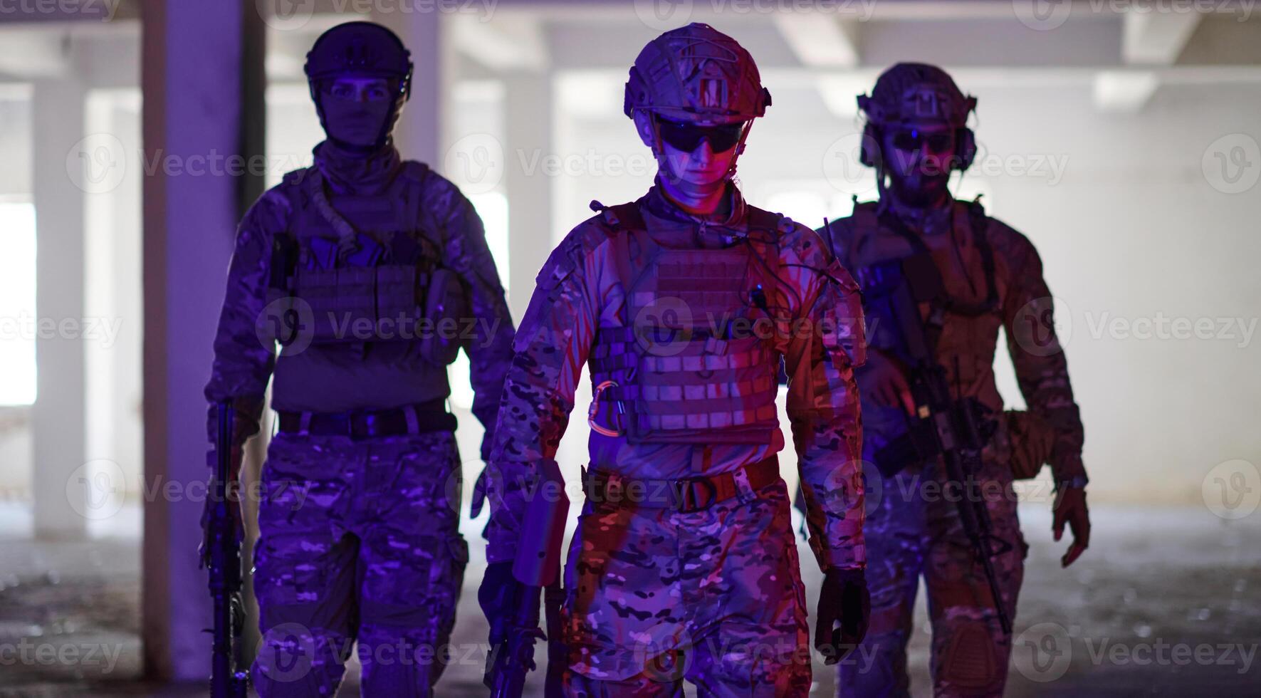 Soldier squad team walking in urban environment colored lightis photo