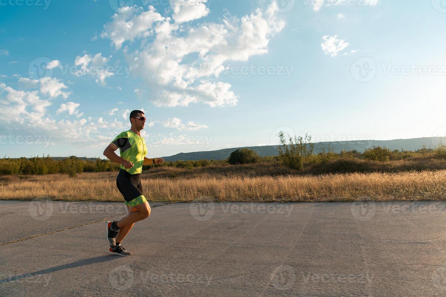 Triathlete in professional gear running early in the morning, preparing for a marathon, dedication to sport and readiness to take on the challenges of a marathon. photo