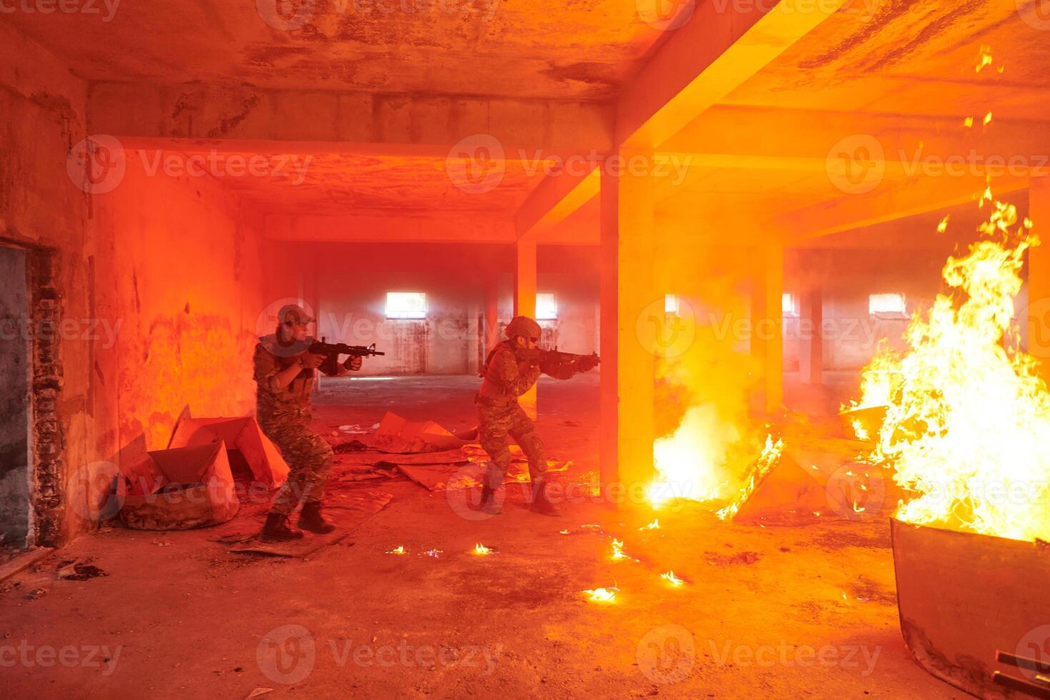 A group of professional soldiers bravely executes a dangerous rescue mission, surrounded by fire in a perilous building. photo