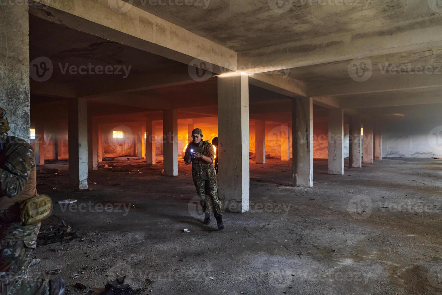 A group of professional soldiers bravely executes a dangerous rescue mission, surrounded by fire in a perilous building. photo