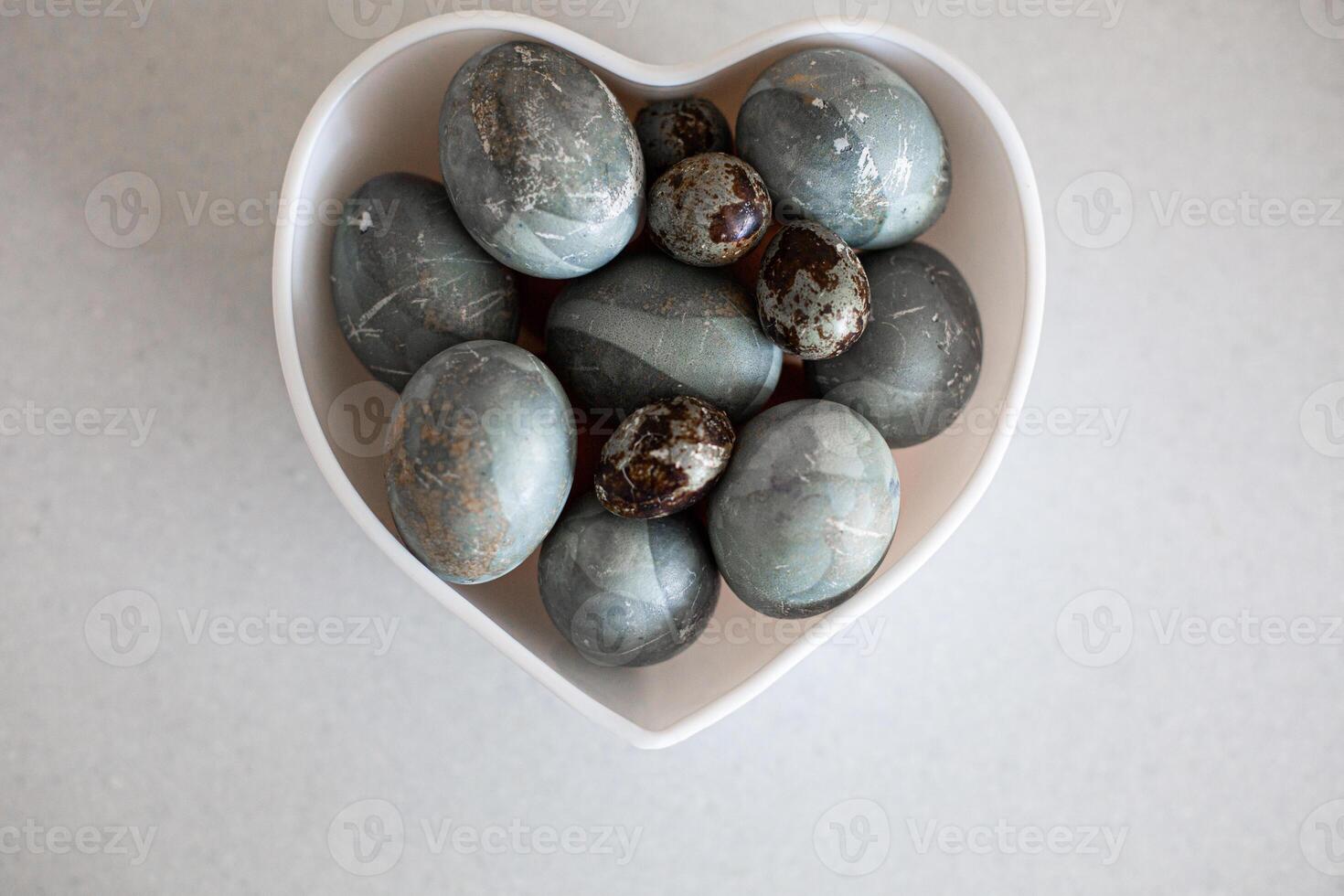 Beautiful colorful grey easter eggs on white background photo