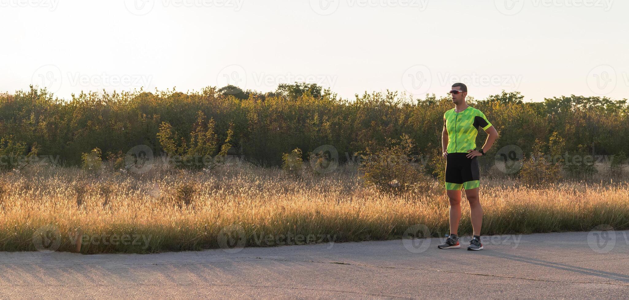 A triathlete resting after a hard morning's run. Training preparation for the upcoming marathon photo
