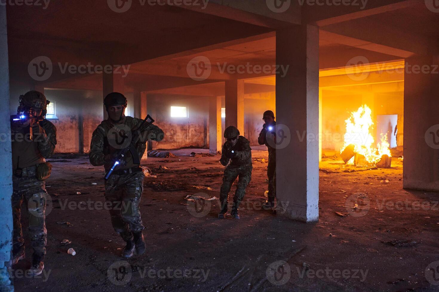 A group of professional soldiers bravely executes a dangerous rescue mission, surrounded by fire in a perilous building. photo