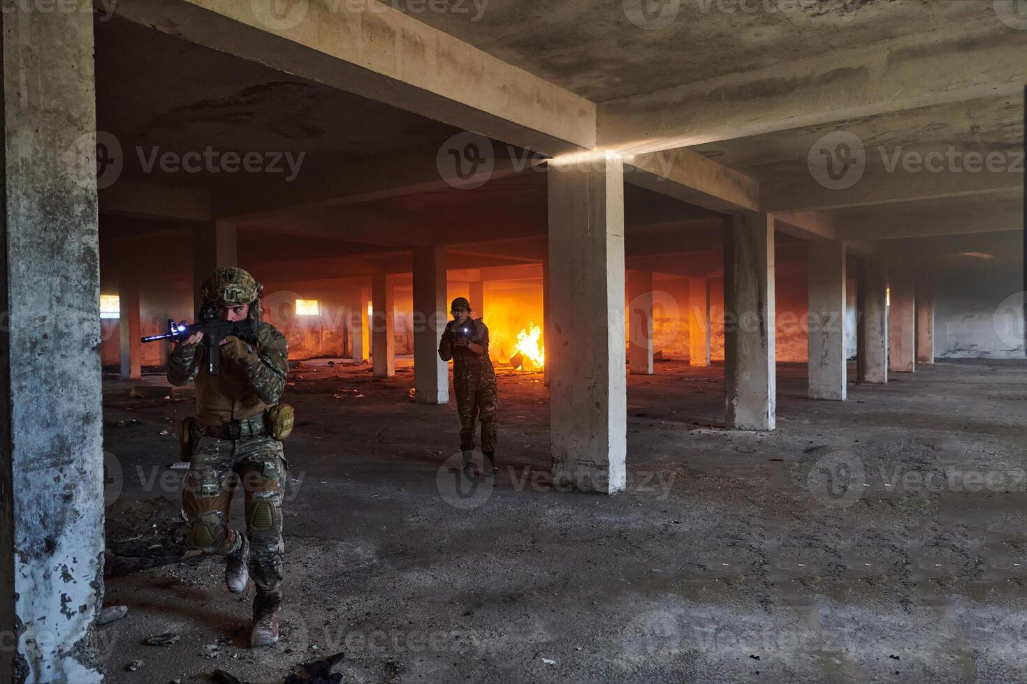 A group of professional soldiers bravely executes a dangerous rescue mission, surrounded by fire in a perilous building. photo