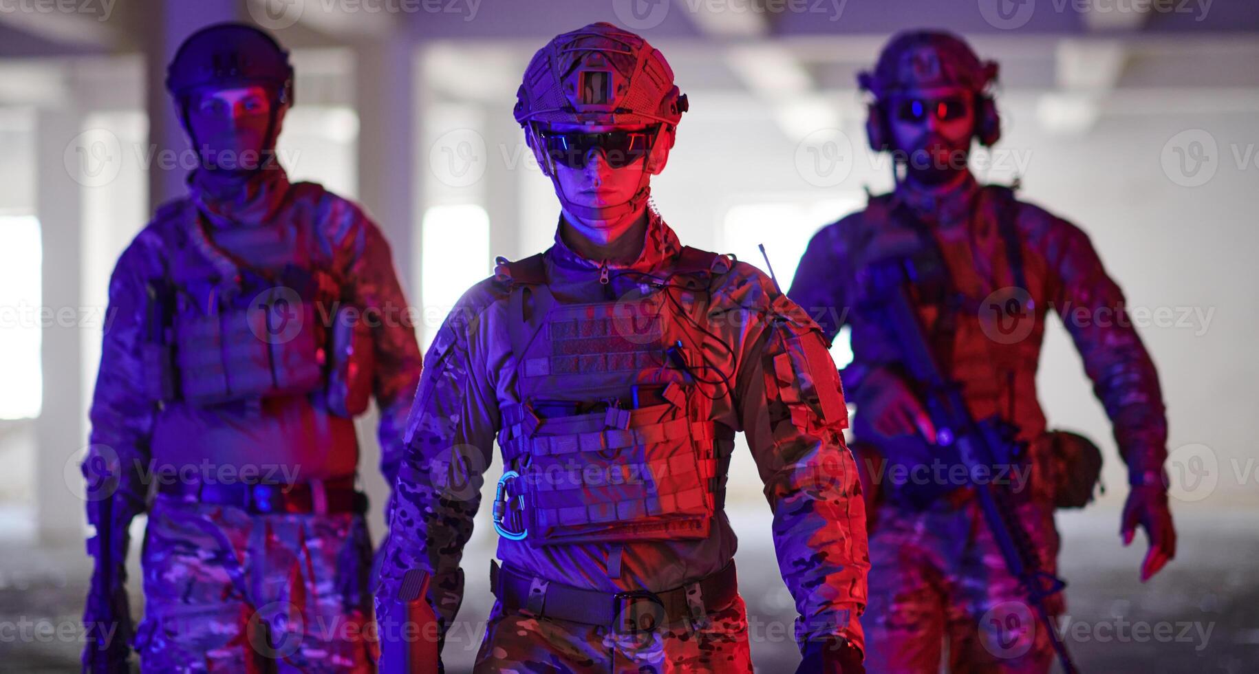 Soldier squad team walking in urban environment colored lightis photo