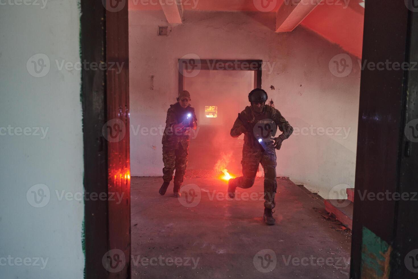A group of professional soldiers bravely executes a dangerous rescue mission, surrounded by fire in a perilous building. photo