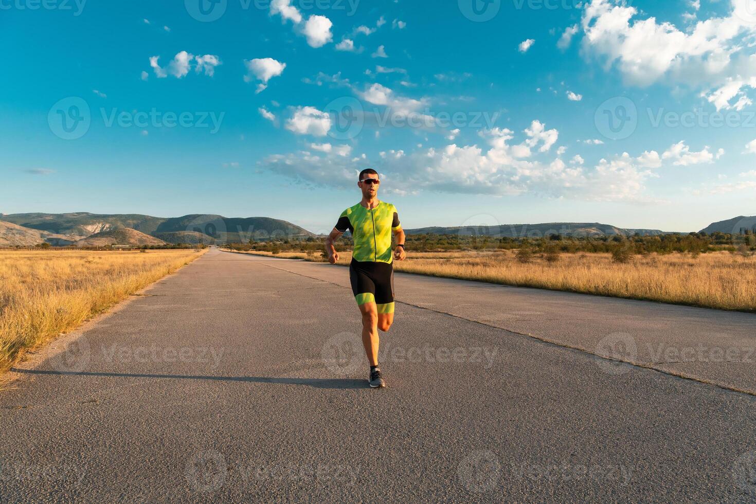 Triathlete in professional gear running early in the morning, preparing for a marathon, dedication to sport and readiness to take on the challenges of a marathon. photo