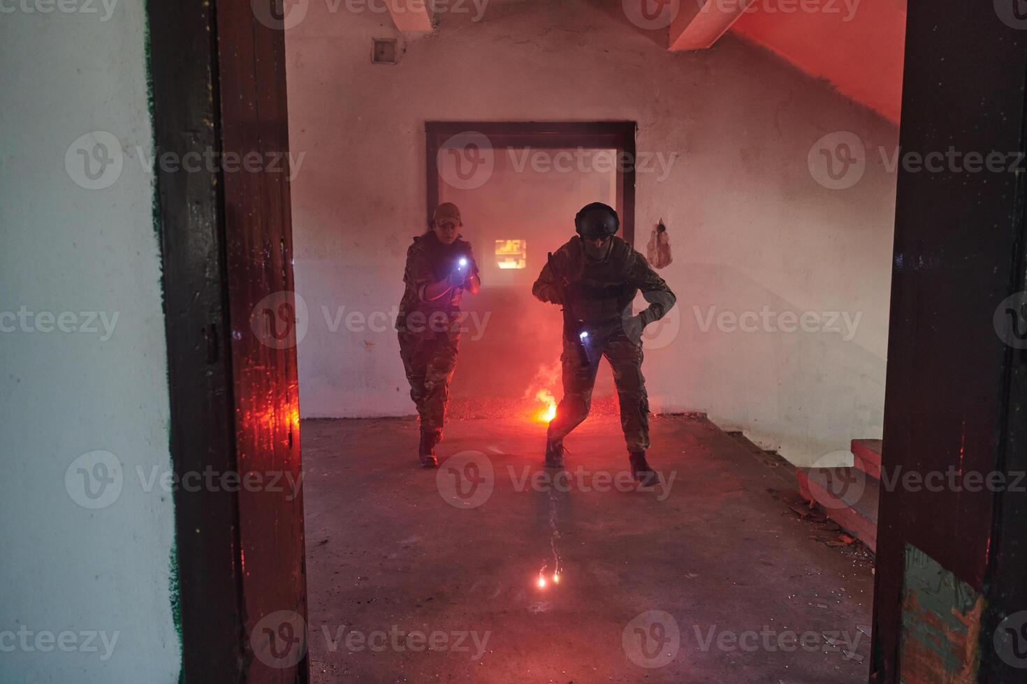 A group of professional soldiers bravely executes a dangerous rescue mission, surrounded by fire in a perilous building. photo