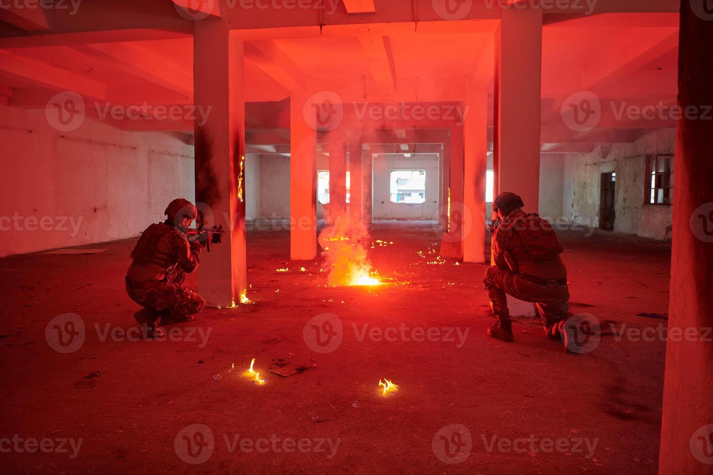 A group of professional soldiers bravely executes a dangerous rescue mission, surrounded by fire in a perilous building. photo