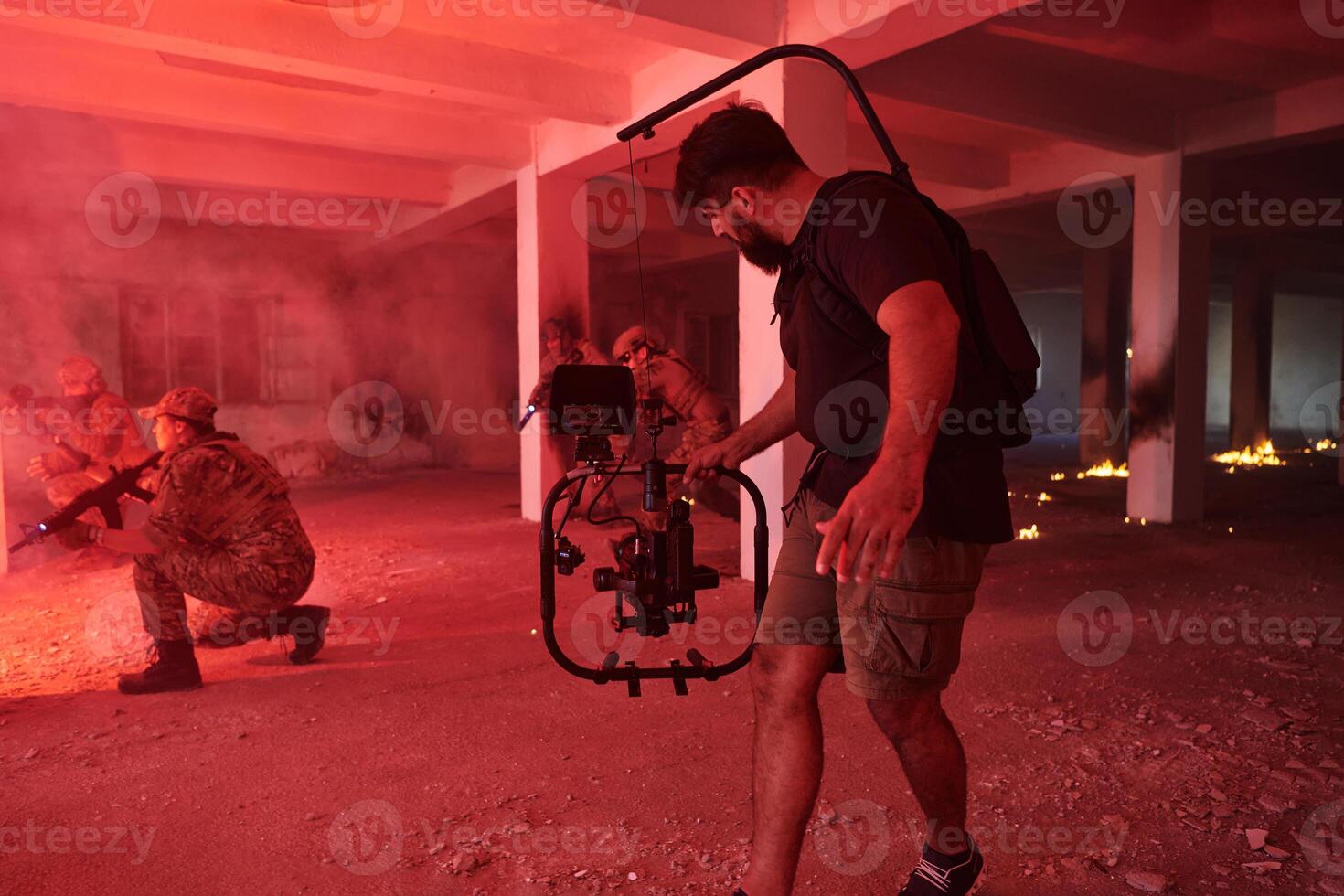 A professional cameraman captures the intense moments as a group of skilled soldiers embarks on a dangerous mission inside an abandoned building, their actions filled with suspense and bravery photo