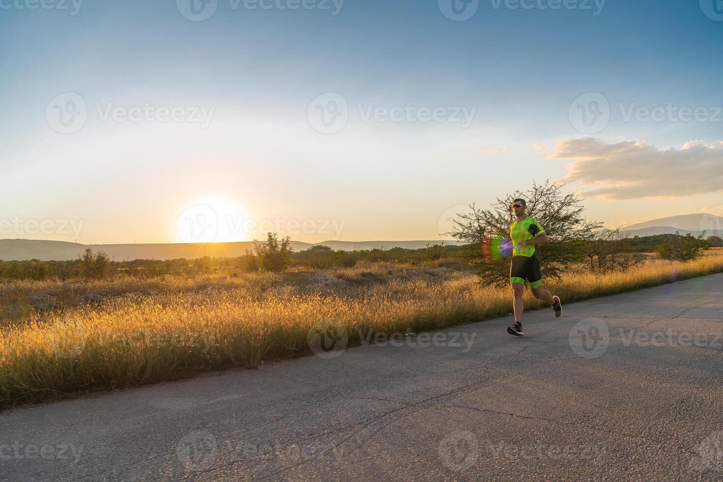 Triathlete in professional gear running early in the morning, preparing for a marathon, dedication to sport and readiness to take on the challenges of a marathon. photo