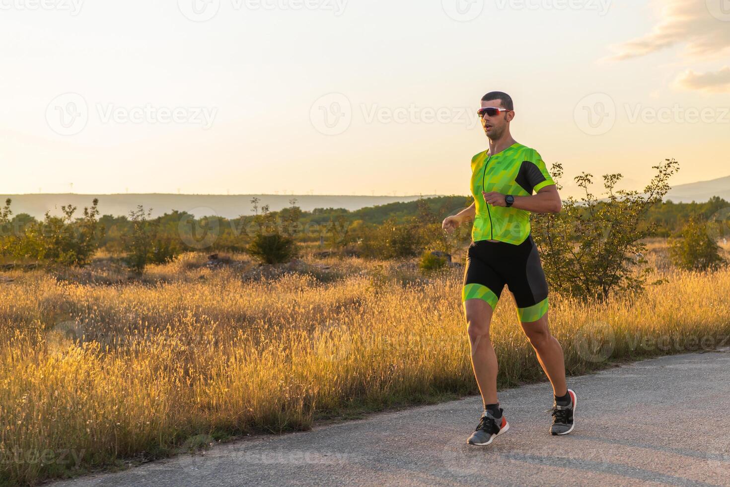 Triathlete in professional gear running early in the morning, preparing for a marathon, dedication to sport and readiness to take on the challenges of a marathon. photo
