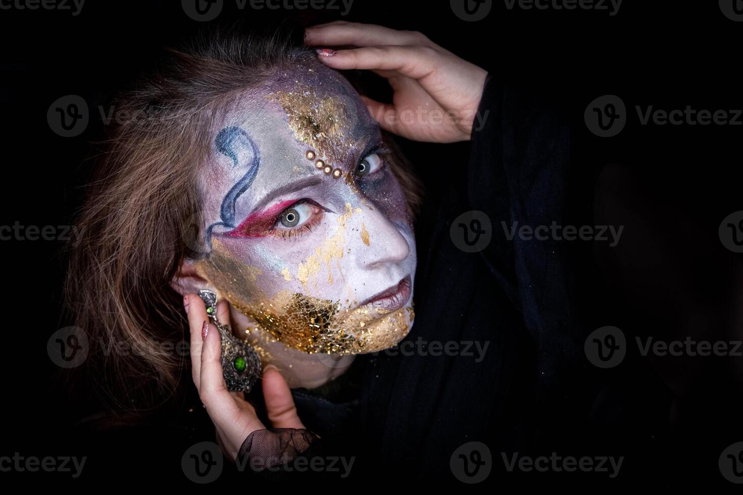 portrait Witch girl with fancy makeup a Halloween holiday photo
