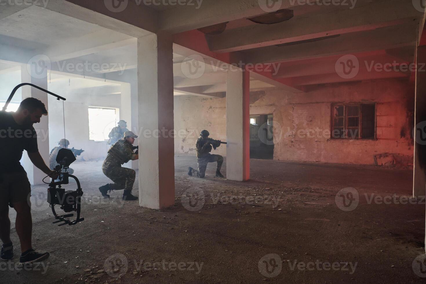 A professional cameraman captures the intense moments as a group of skilled soldiers embarks on a dangerous mission inside an abandoned building, their actions filled with suspense and bravery photo