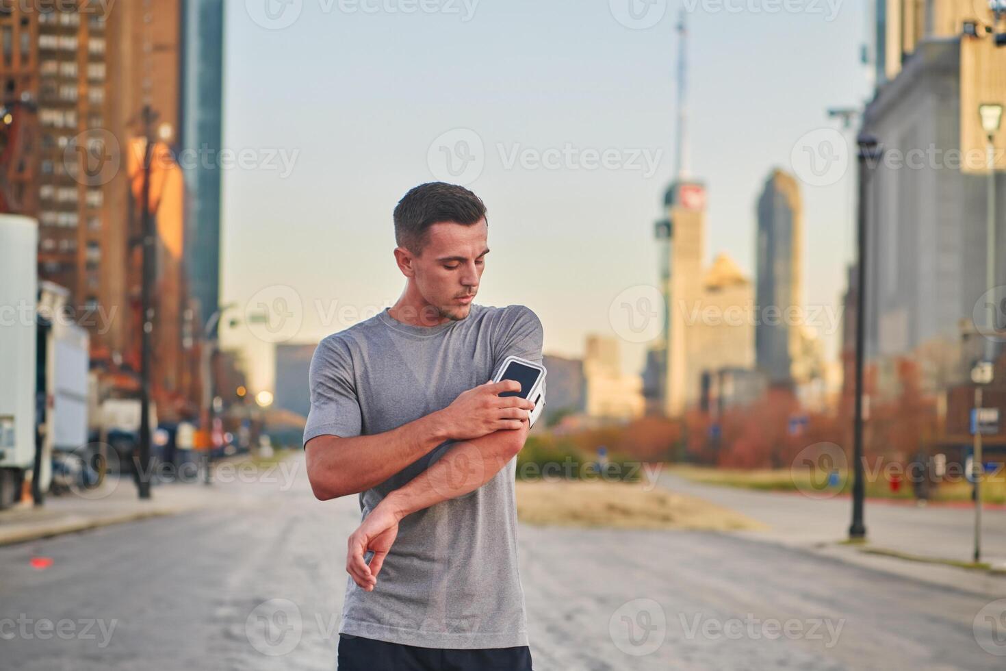 Handsome man checking his smartphone after a morning run on the vibrant streets of New York City, seamlessly blending his active lifestyle with the modern convenience of technology, as he engages with photo