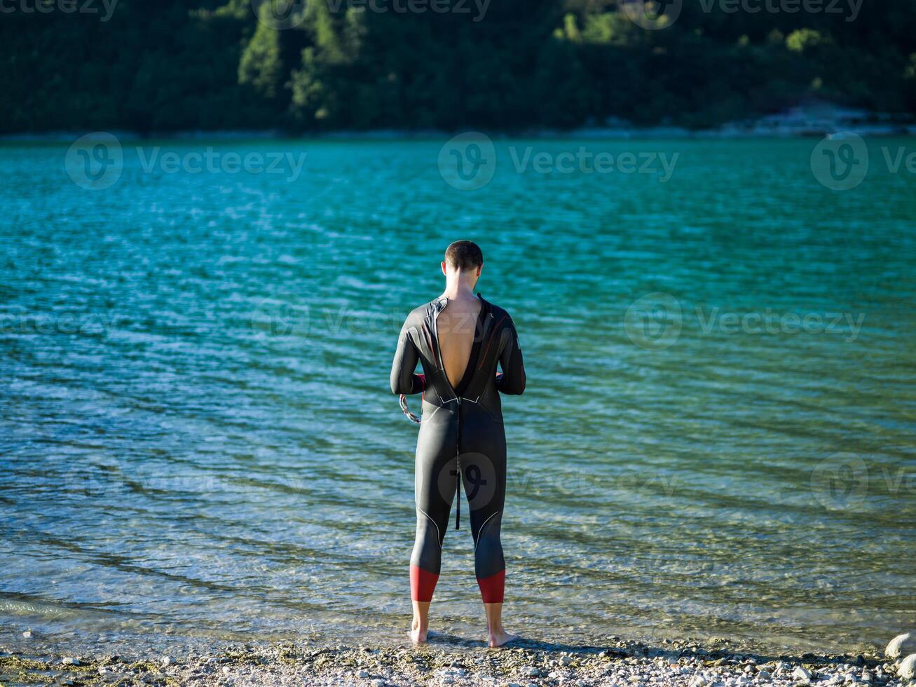 A triathlon swimmer preparing for a river training to gear up for a marathon photo