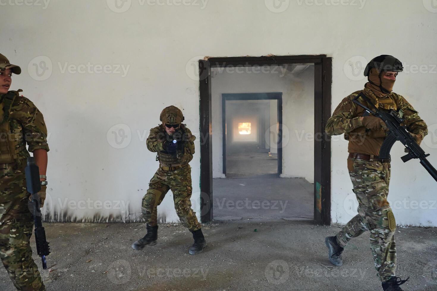 A group of professional soldiers bravely executes a dangerous rescue mission, surrounded by fire in a perilous building. photo