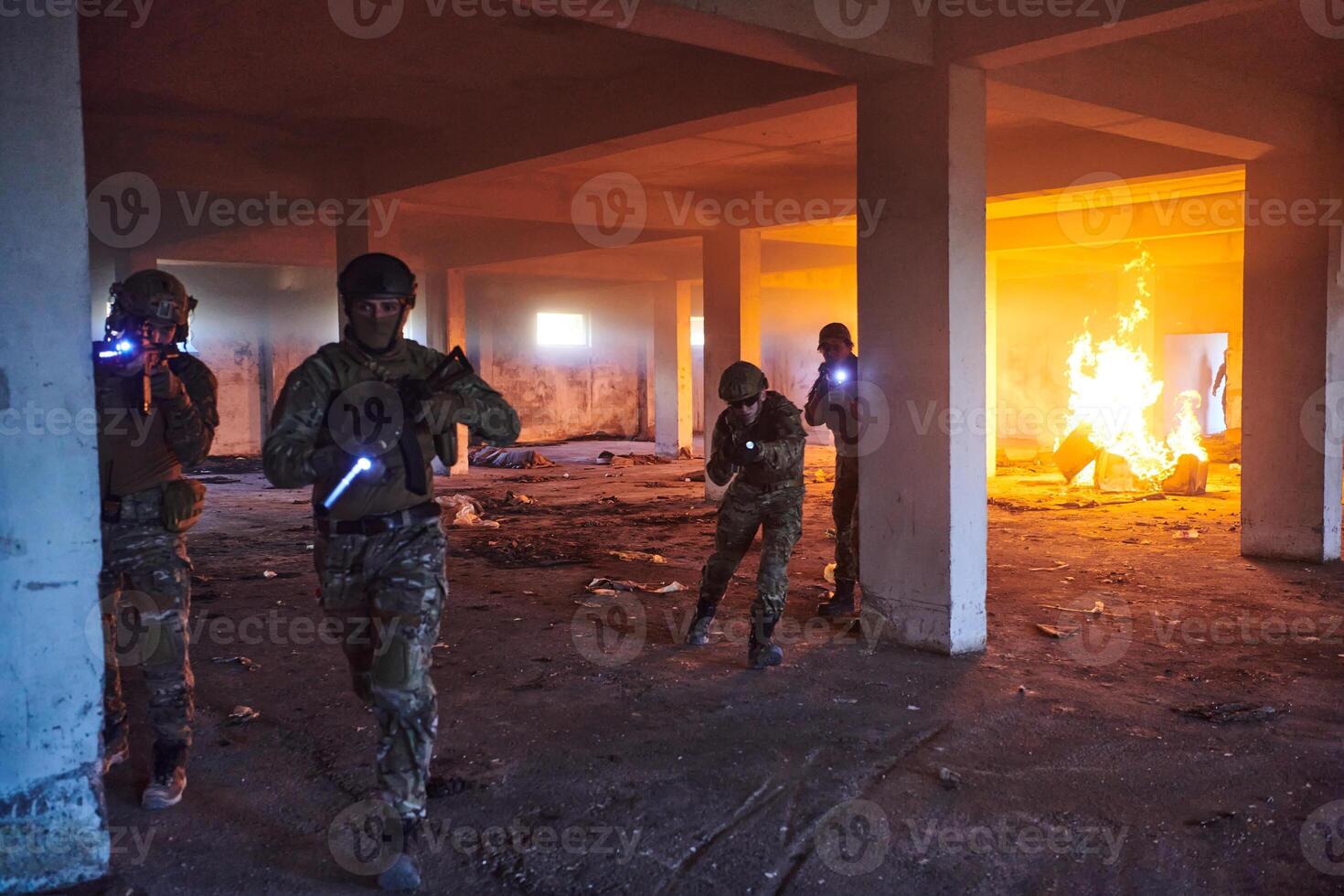 A group of professional soldiers bravely executes a dangerous rescue mission, surrounded by fire in a perilous building. photo