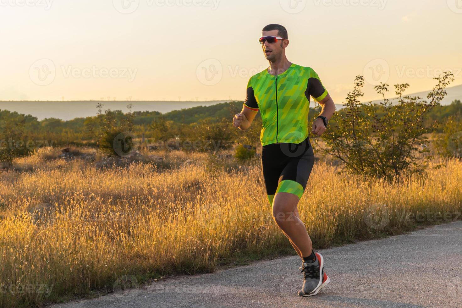 Triathlete in professional gear running early in the morning, preparing for a marathon, dedication to sport and readiness to take on the challenges of a marathon. photo