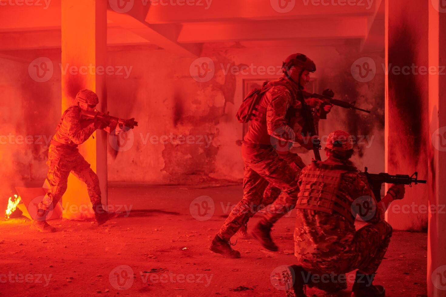 A group of professional soldiers bravely executes a dangerous rescue mission, surrounded by fire in a perilous building. photo