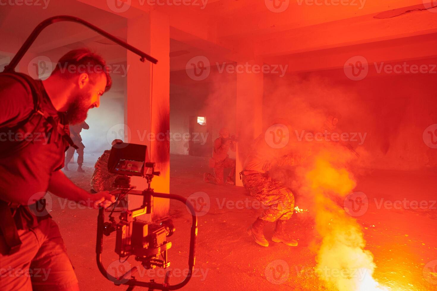A professional cameraman captures the intense moments as a group of skilled soldiers embarks on a dangerous mission inside an abandoned building, their actions filled with suspense and bravery photo