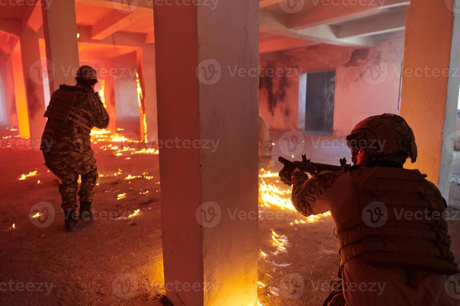 A group of professional soldiers bravely executes a dangerous rescue mission, surrounded by fire in a perilous building. photo