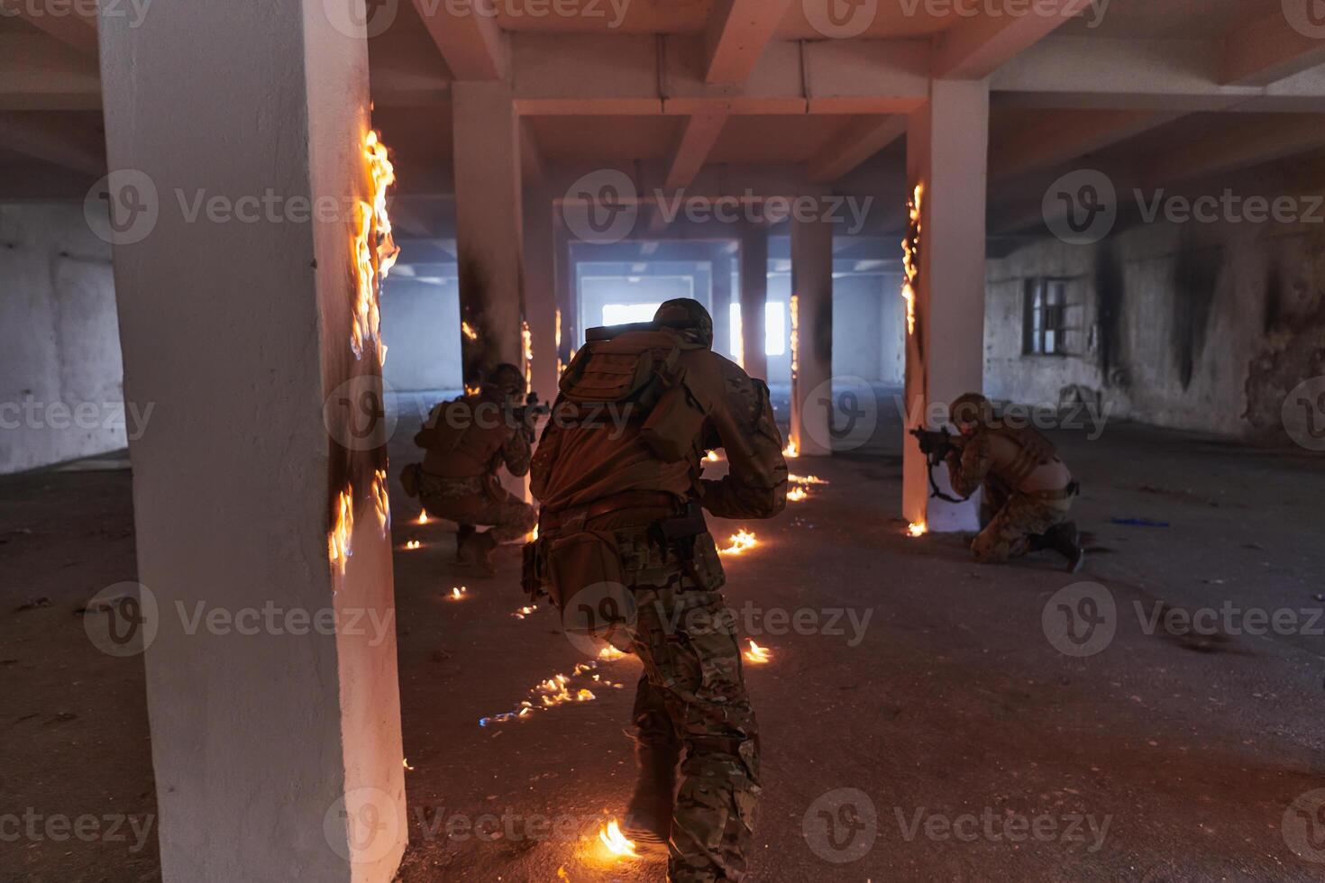 A group of professional soldiers bravely executes a dangerous rescue mission, surrounded by fire in a perilous building. photo