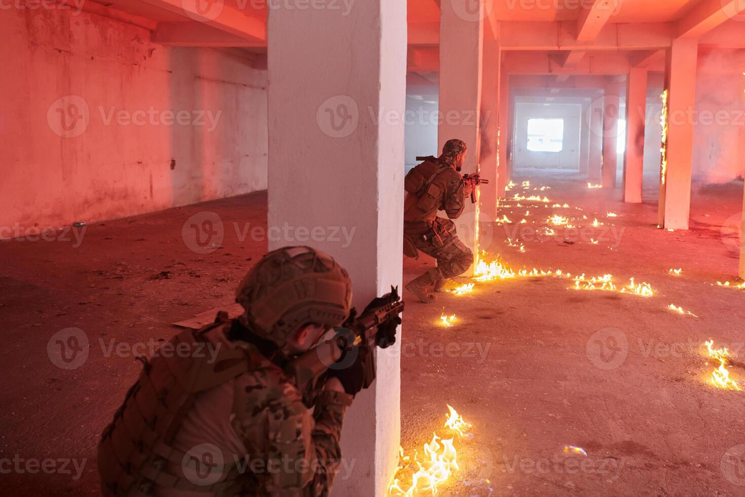 A group of professional soldiers bravely executes a dangerous rescue mission, surrounded by fire in a perilous building. photo