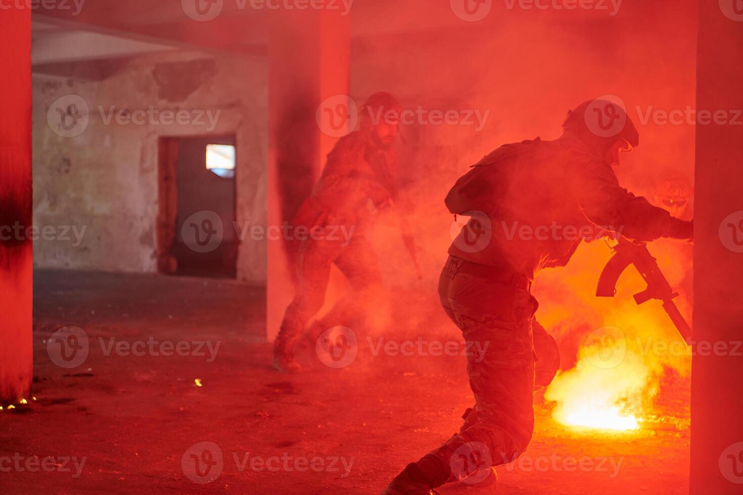 A group of professional soldiers bravely executes a dangerous rescue mission, surrounded by fire in a perilous building. photo