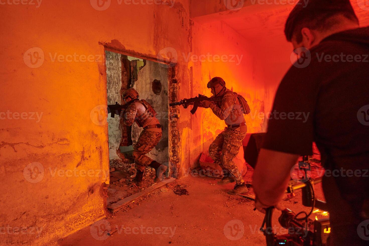 A professional cameraman captures the intense moments as a group of skilled soldiers embarks on a dangerous mission inside an abandoned building, their actions filled with suspense and bravery photo