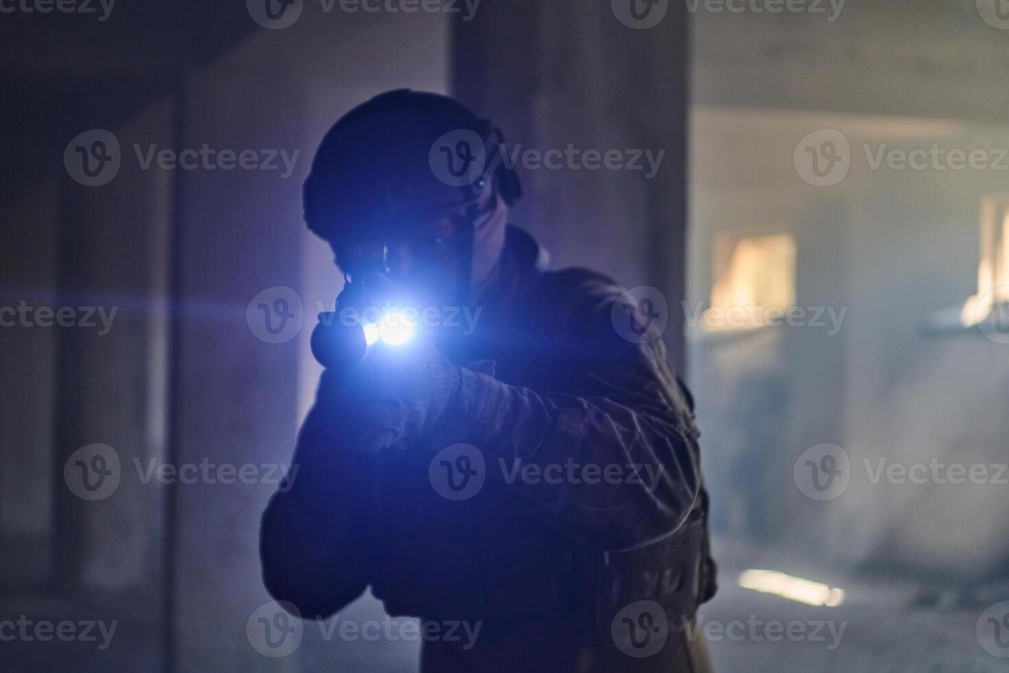 A professional soldier in an abandoned building shows courage and determination in a war campaign photo