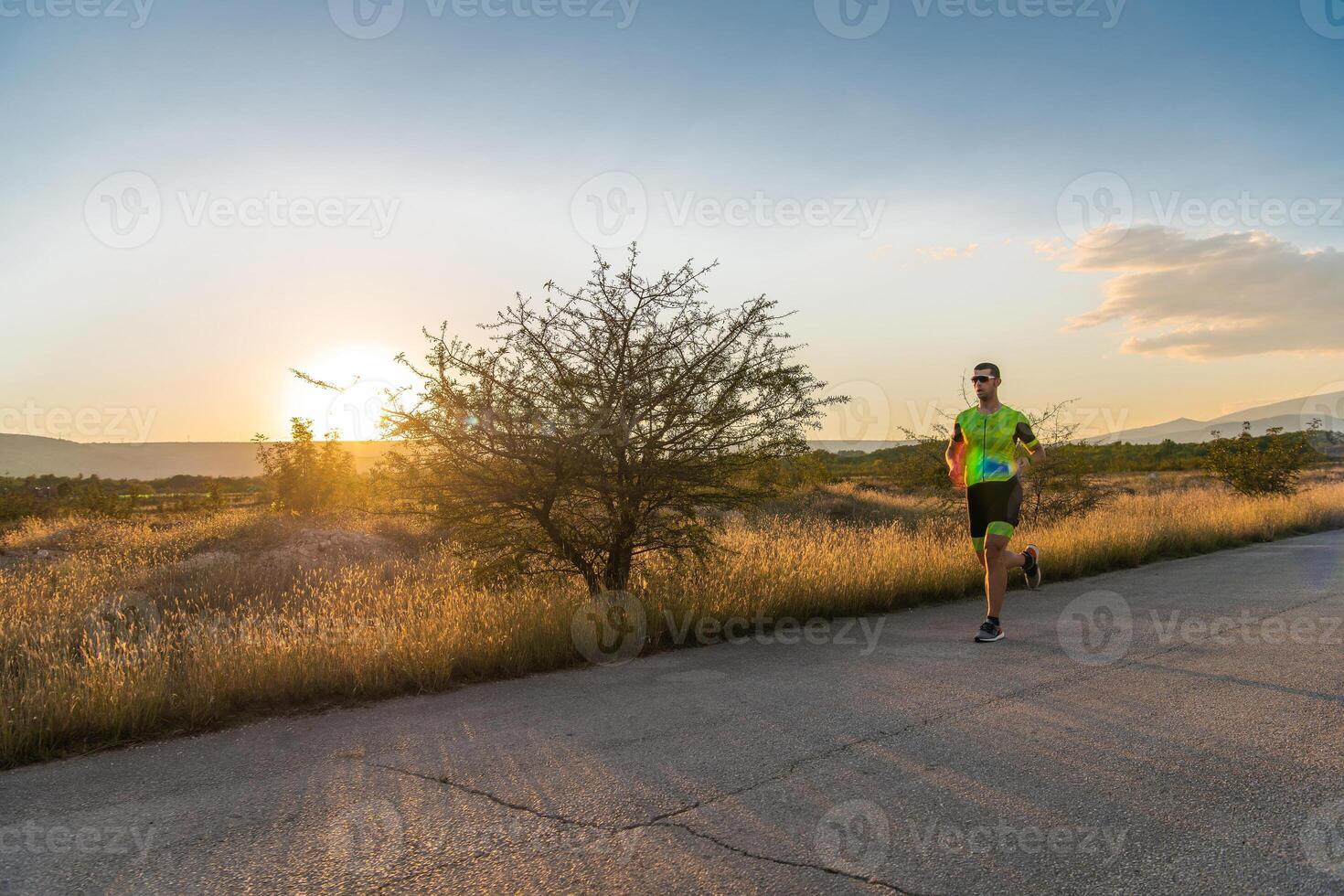 Triathlete in professional gear running early in the morning, preparing for a marathon, dedication to sport and readiness to take on the challenges of a marathon. photo