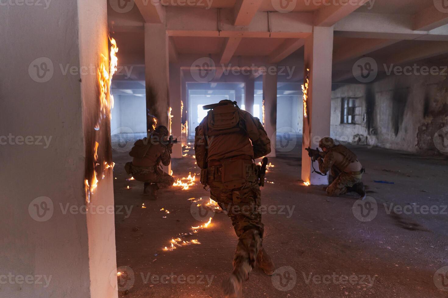 A group of professional soldiers bravely executes a dangerous rescue mission, surrounded by fire in a perilous building. photo