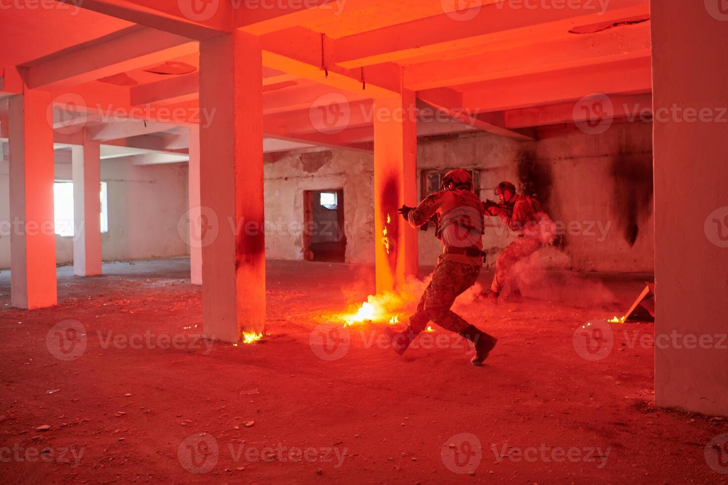 A group of professional soldiers bravely executes a dangerous rescue mission, surrounded by fire in a perilous building. photo