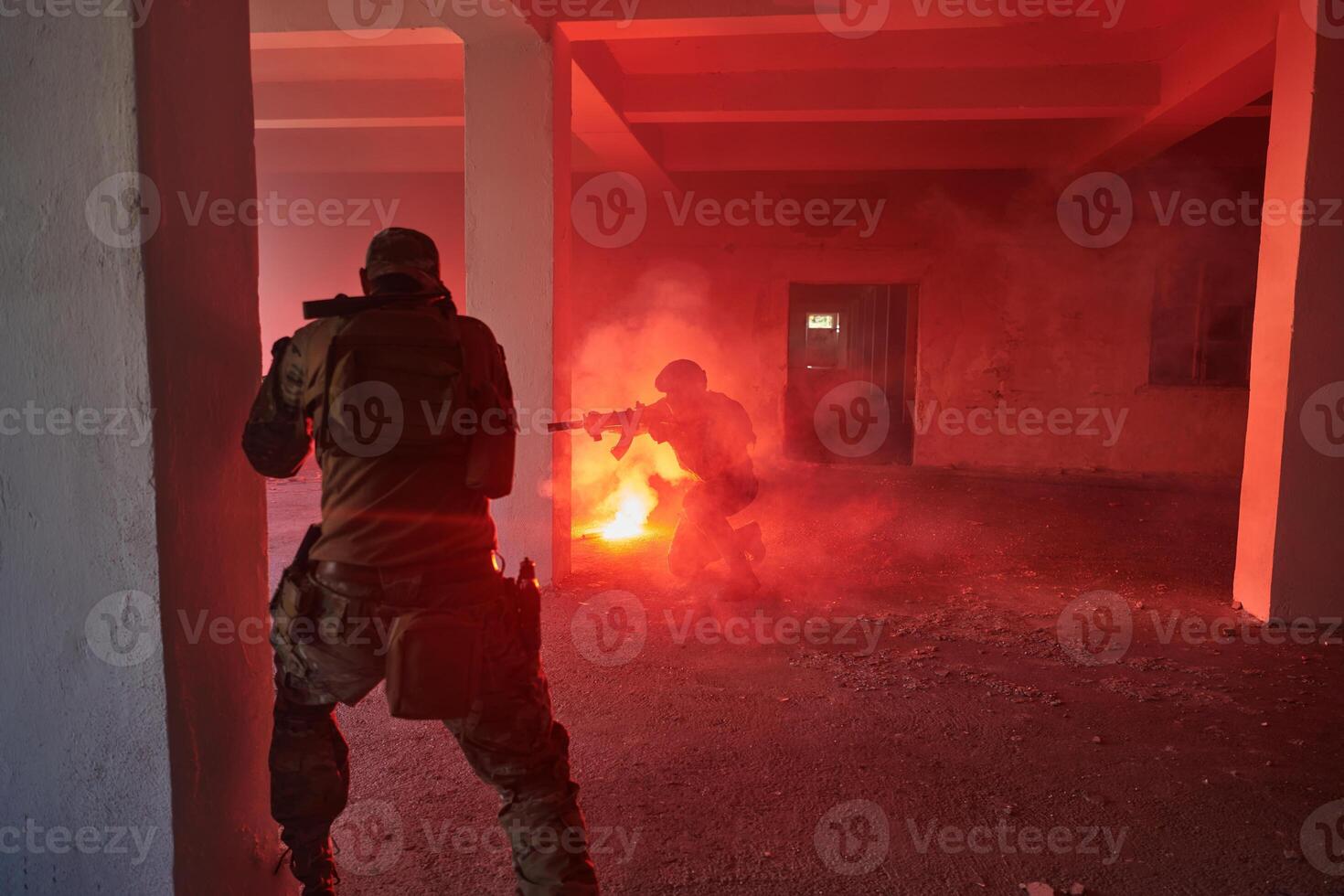A group of professional soldiers bravely executes a dangerous rescue mission, surrounded by fire in a perilous building. photo