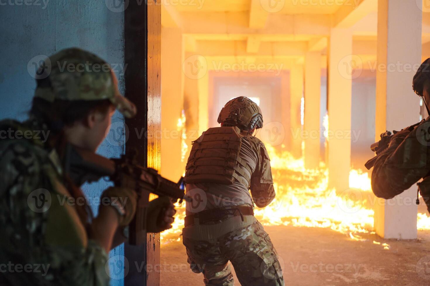 A group of professional soldiers bravely executes a dangerous rescue mission, surrounded by fire in a perilous building. photo