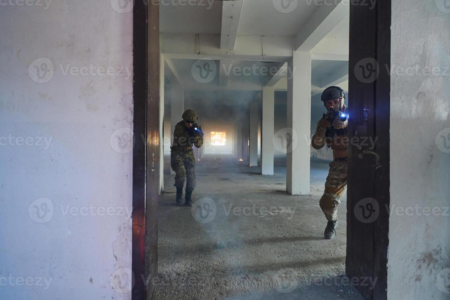 A group of professional soldiers bravely executes a dangerous rescue mission, surrounded by fire in a perilous building. photo