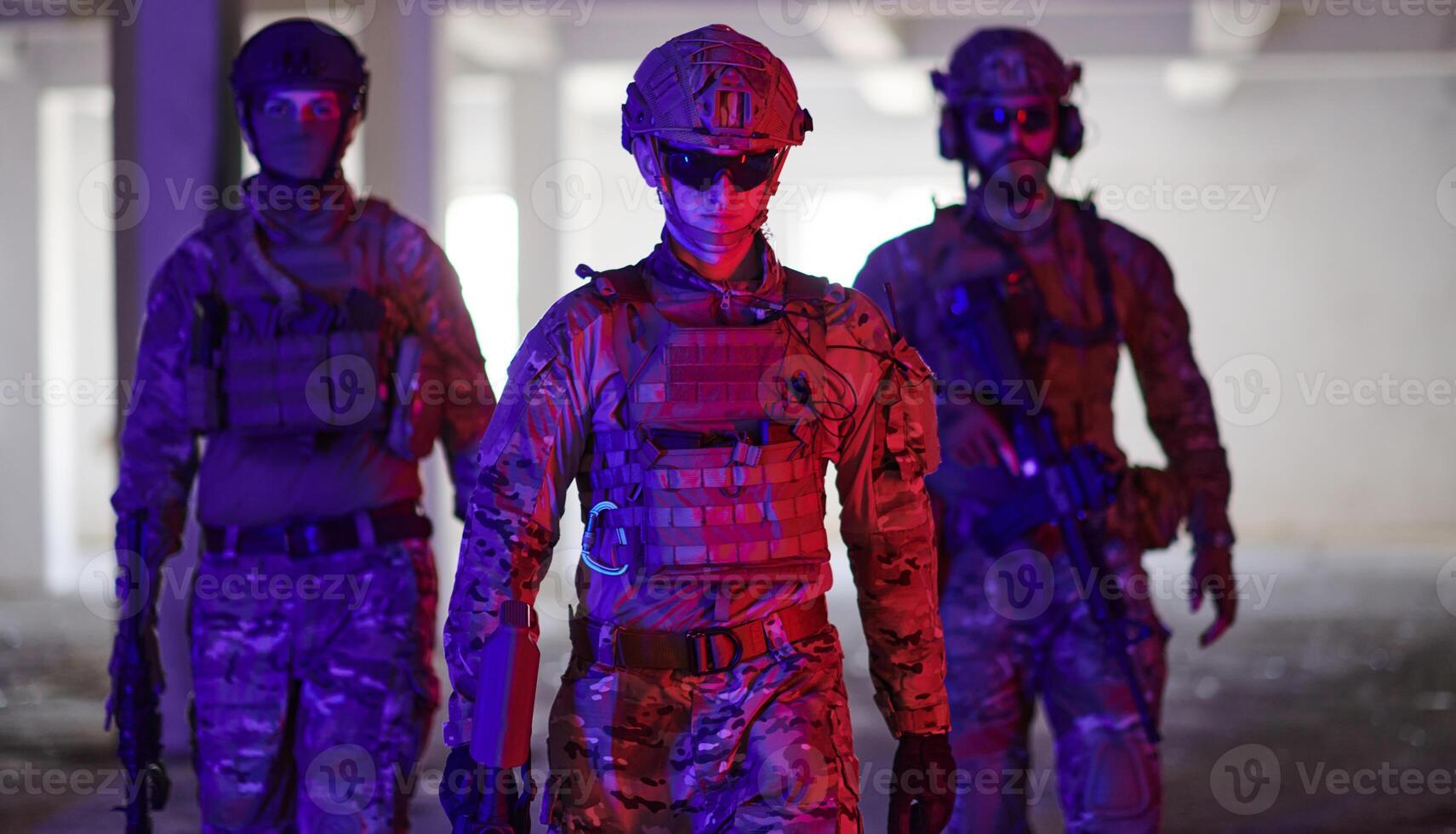 Soldier squad team walking in urban environment colored lightis photo
