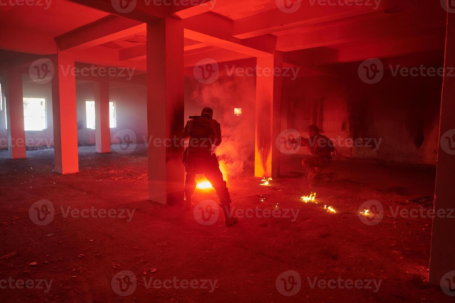 A group of professional soldiers bravely executes a dangerous rescue mission, surrounded by fire in a perilous building. photo