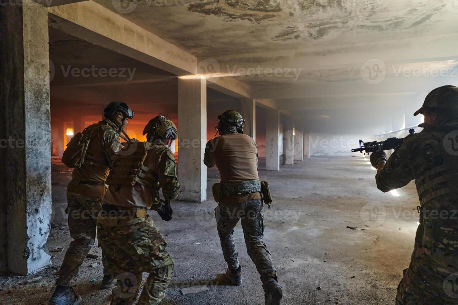A group of professional soldiers bravely executes a dangerous rescue mission, surrounded by fire in a perilous building. photo